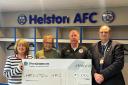 L-R: Sandra Egan [Helston AFC Treasurer], Jane Cartwright, Paul Hendy, Cllr Guy Foreman receive the cheque