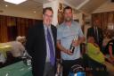 Falmouth Golf Club professional Nick Rogers (left) giving Ray Longstaff his prize