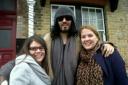 Michaela and Rhiann Kemp are given a hug by Russell Brand