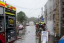 Firefighters try to save a house at St Johns Road in Helston from flooding. Photo: Kathy White