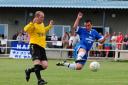 An impressive kick from Helston’s new signing, Kevin Lawrence, fails to beat ‘keeper Danny Burrows (right)