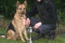 PC Guy Williams and dog Ben toast their success.  