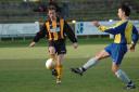 Town's Jamie Morrison-Hill nicks the ball away just in time as a Clyst Rovers player closes in on the ball 
