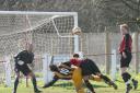 GOING DOWN: Town's Andy Bowker is unceremoniously bundled over by a defender as he attempts to get an effort on goal