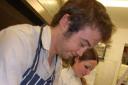 Matt Ferguson is shown by pastry chef Judith how to make bread rolls