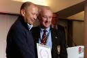 Alan Truscott receives his award from England coach Eddie Jones