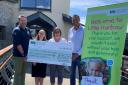 Brian Fisher and Martin Mills handing over the cheque to Children’s Hospice South west at Little Harbour