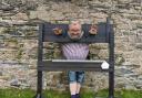 Rev Danny Reed in the stocks ready to have wet sponges thrown at him