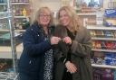 Sandy Skinner hands over the keys to Laura Smythe at Flushing Stores