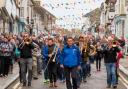 Helston Town Band lead the procession through the town on May Day 2019