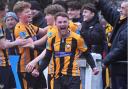 Luke Barner celebrates the win for Falmouth Town