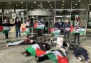 Pro-Palestinian supporter staged a die-in outside the entrance to New County Hall in Truro