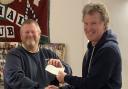 Chris Lee, trustee of Pendennis Leisure, receiving the cheque from Phil Samuel