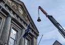 The new bell affectionally named 'Flora' being lifted to the Guildhall bell tower
