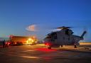 RNAS Culdrose Merlin helicopter taking off at dusk