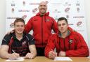 Matt Bolwell (left) and Marcus Garratt (right) put pen to paper on the deals with forwards coach Alan Paver overlooking them. Picture: SIMON BRYANT/ITKIS PHOTO