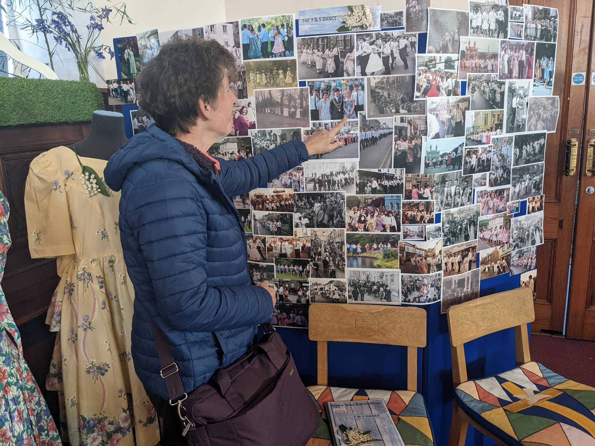 Dee Perry looking at a photo of the late Lorna Howells, a childhood friend.