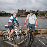 Hugh Roberts and Robin Young pictured after the Scarborough leg of their cycle around the coastline of Britain. Pic: SWPix