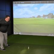 Picture: The state of the Art Golf Simulator. Here we see club Professional Nick Rogers teeing off on the 18th at St Andrews.