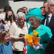 A young girl gets within touching distance of the Queen at the opening of the Tremough Campus in 2006
