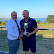 Peter Lewis (left)  Vice Captain of Falmouth Golf Club presenting the Bearne Cup to Mike Davies