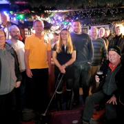 Staff, customers and CAMRA Kernow members celebrate the awards at the Blue Anchor pub in Helston