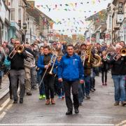 Helston Town Band lead the procession through the town on May Day 2019