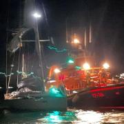 The Penlee Lifeboat arrives safely back to Newlyn with the yacht