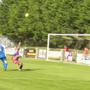 Curtis Damerell lobs the Shepton Mallet keeper