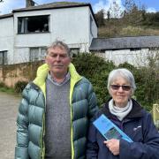 Simon Fielder and Helen Hastings, of the Friends of Pendower Beach, outside the 'Pink Hotel' (which has had a paint job) which could become the site of an aparthotel