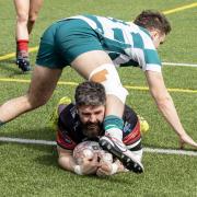 Camborne hooker Ben Priddey grounds one of his five tries in the big win at Exeter University