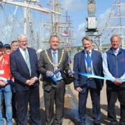 Mayor John Body cuts the ribbon to official open the Falmouth Tall Ships Regatta
