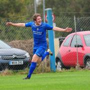 Charlie Young celebrates after opening the scoring for Helston against Illogan RBL earlier this season