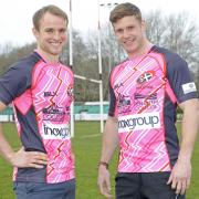 Tom Kessell and Matt Evans show off the pink kits the Pirates will be wearing on Sunday. Picture: SIMON BRYANT/ITKIS PHOTO