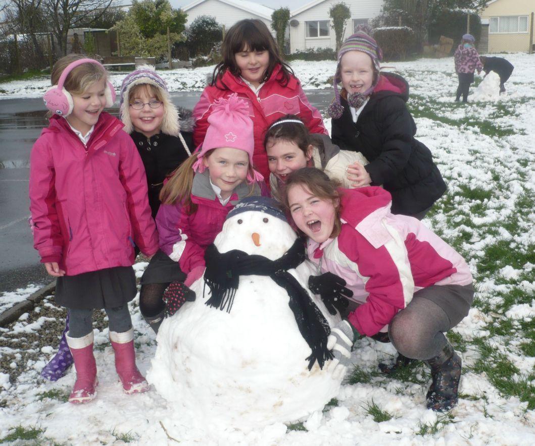 Youngsters at Landewednack enjoy the opportunity to build a Cornish snowman