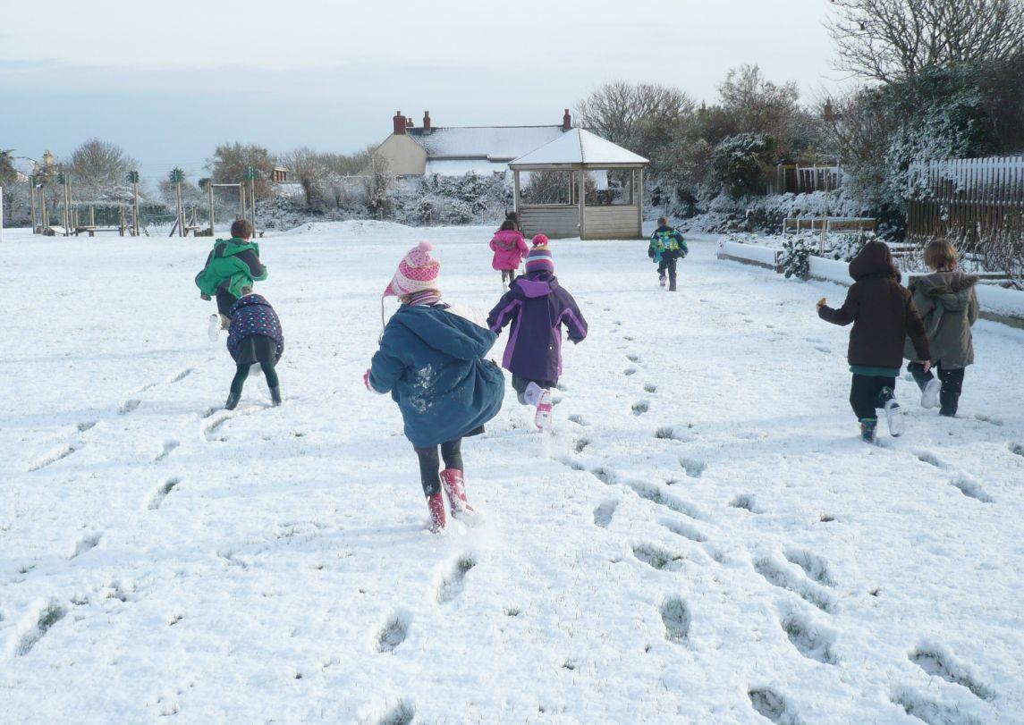 Kids having fun running through the snow in Landewednack