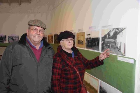 Malcolm and Carla Eddy look at old photographs