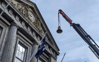 The new bell affectionally named 'Flora' being lifted to the Guildhall bell tower