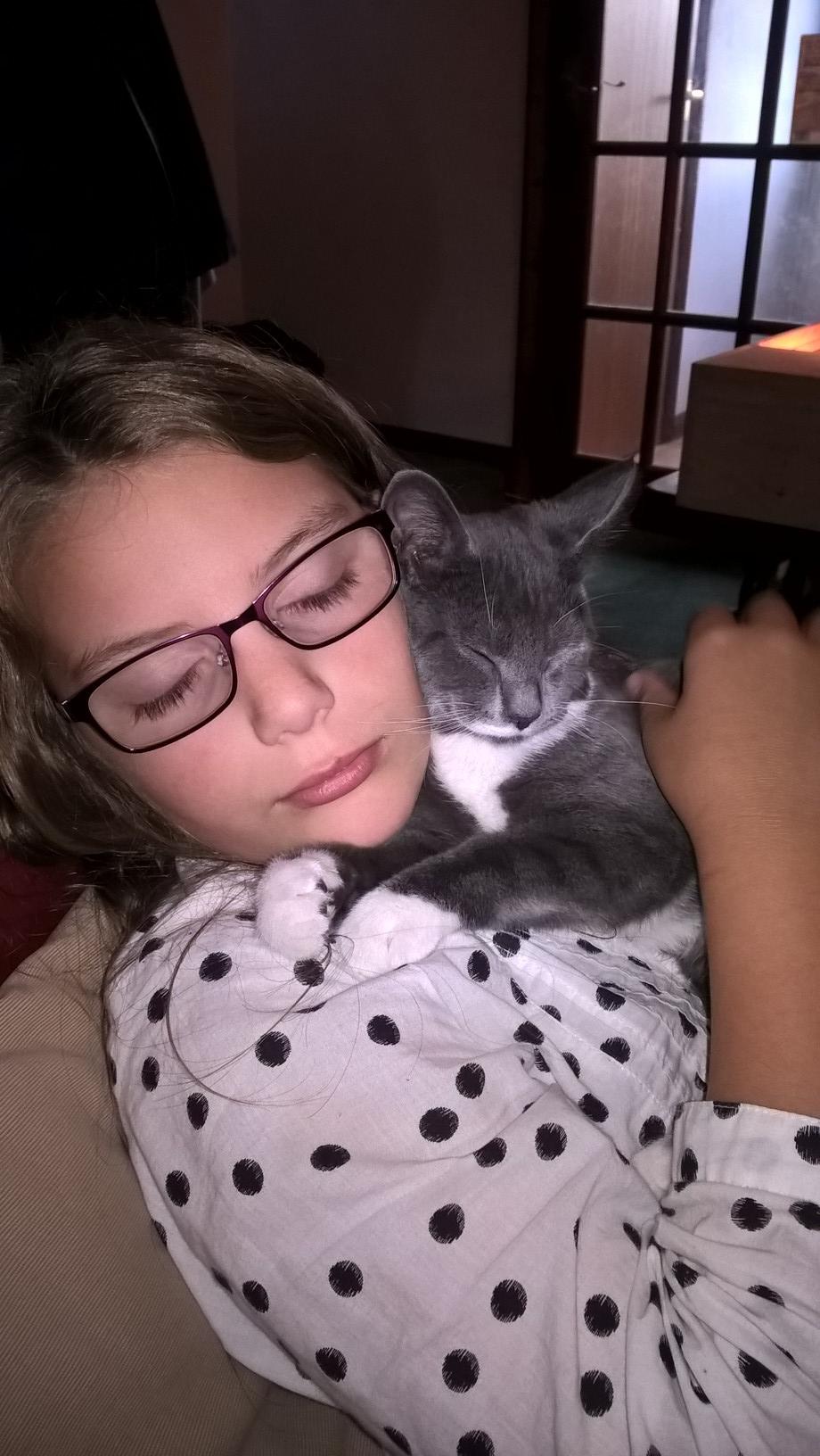 Amy Inns dozing with her beloved cat MegMog