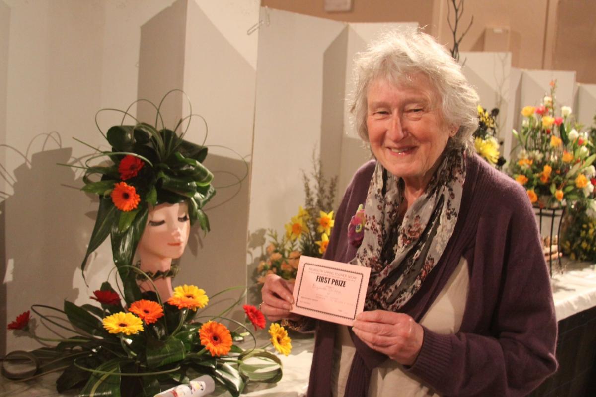 inner of best exhibit, ( top prize) Elizabeth Doidge with her Hairspray (the stage show) inspired floral art.