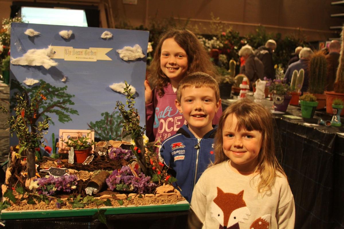 Bethany, 10, Daniel, 8, and Jessica, 8 from King Charles school gardening club with the school's winning entry