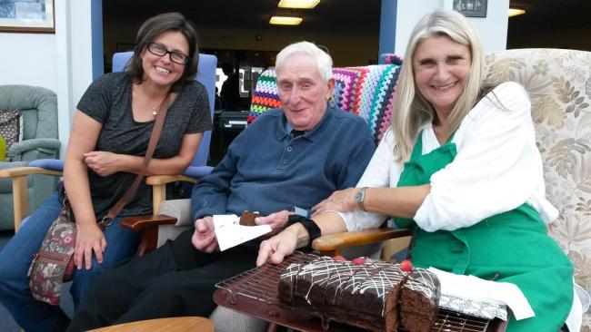 90 year old Robert Hopkins enjoys meeting friendly faces at Hayle Hub free lunch, shown here with Hayle Hub members Jane Haskins (left) and Alison Saunders.
