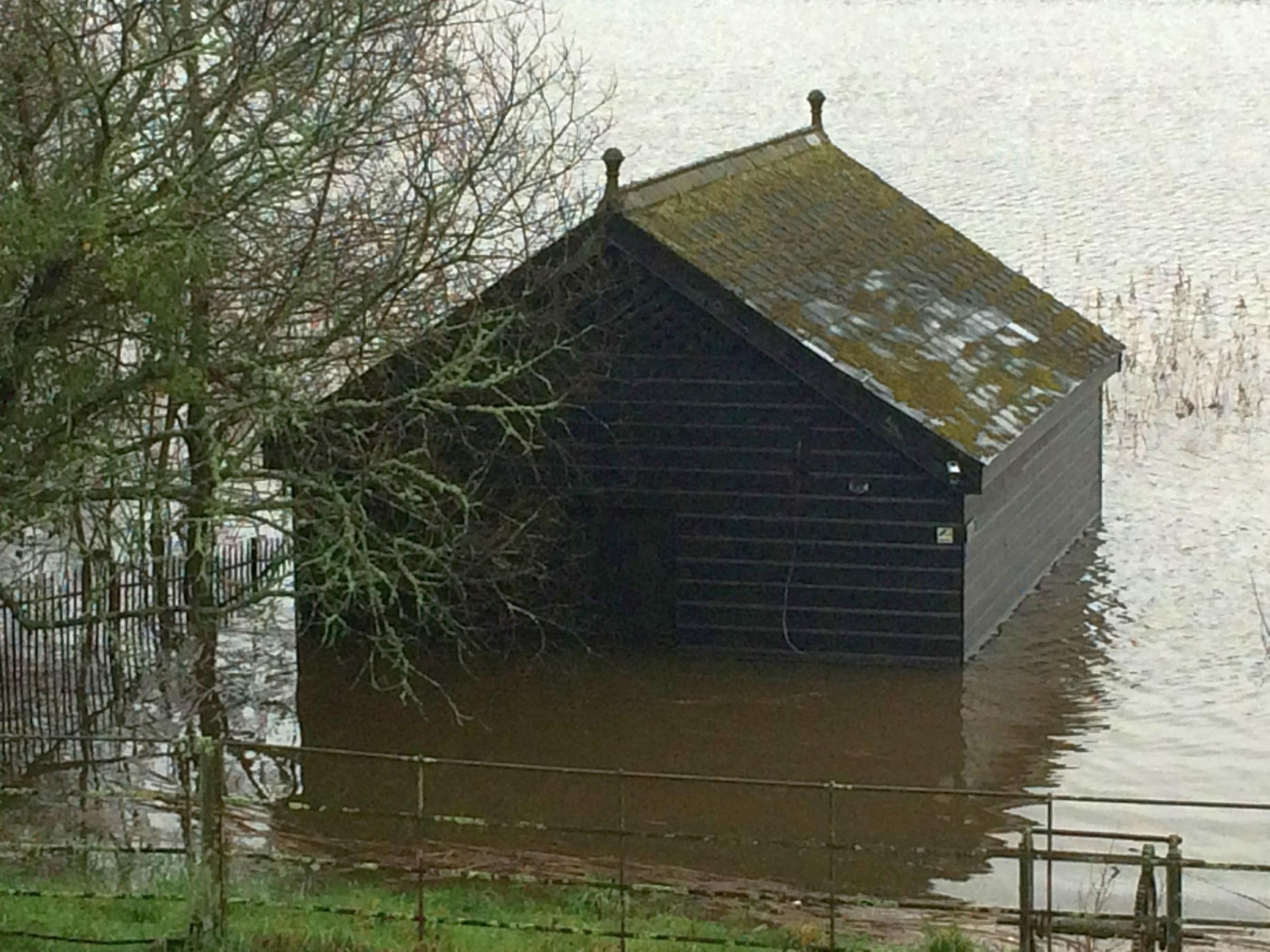Water comes halfway up the boathouse by Loe Pool