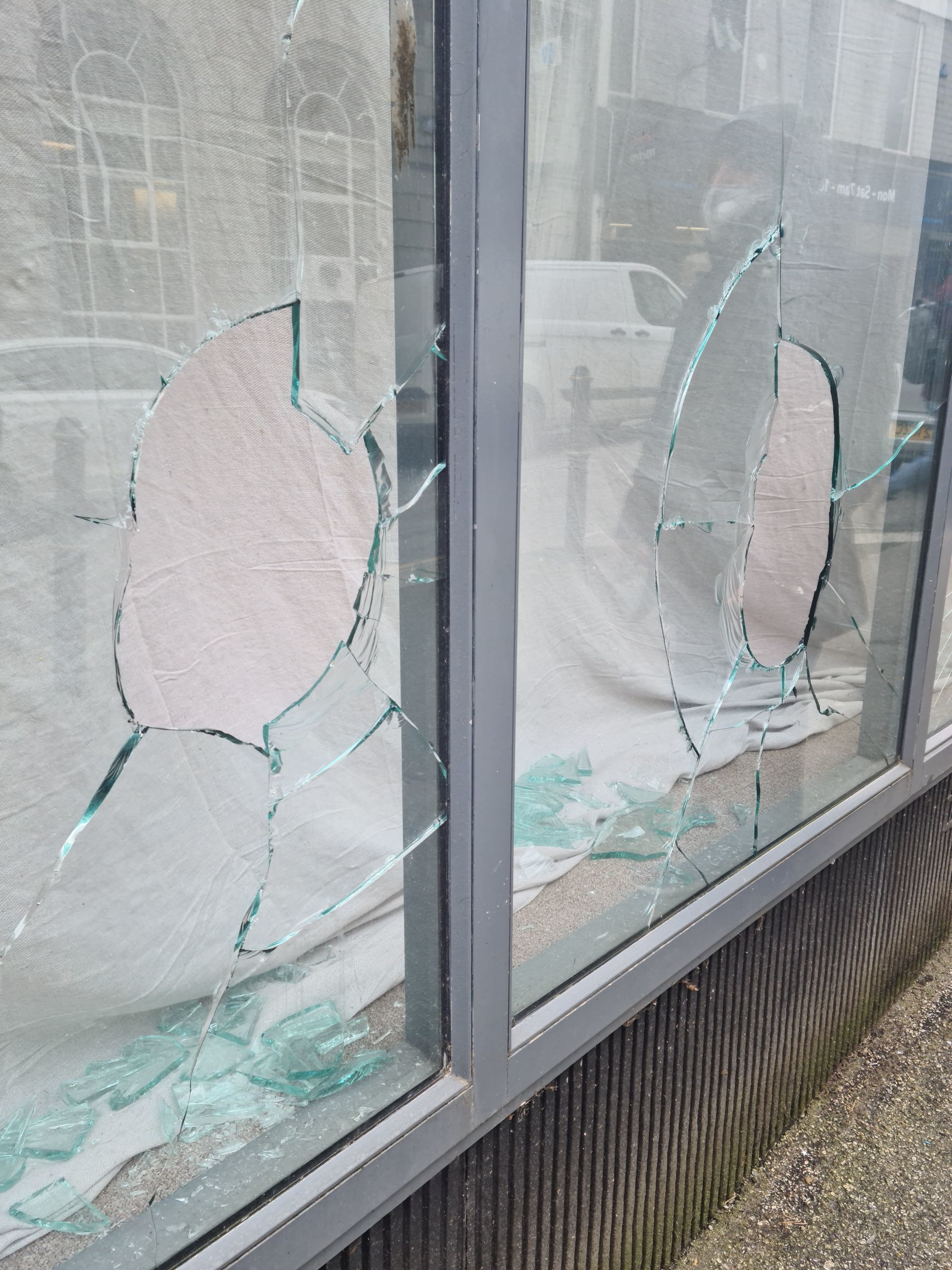 The smashed windows of the new kebab shop in Killigrew Street