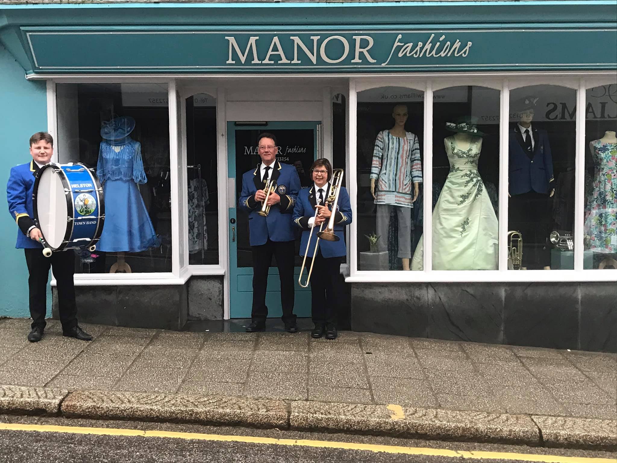 Band members Ben, David and Ann outside Anns Manor Fashions shop in town. Picture: Helston Town Band
