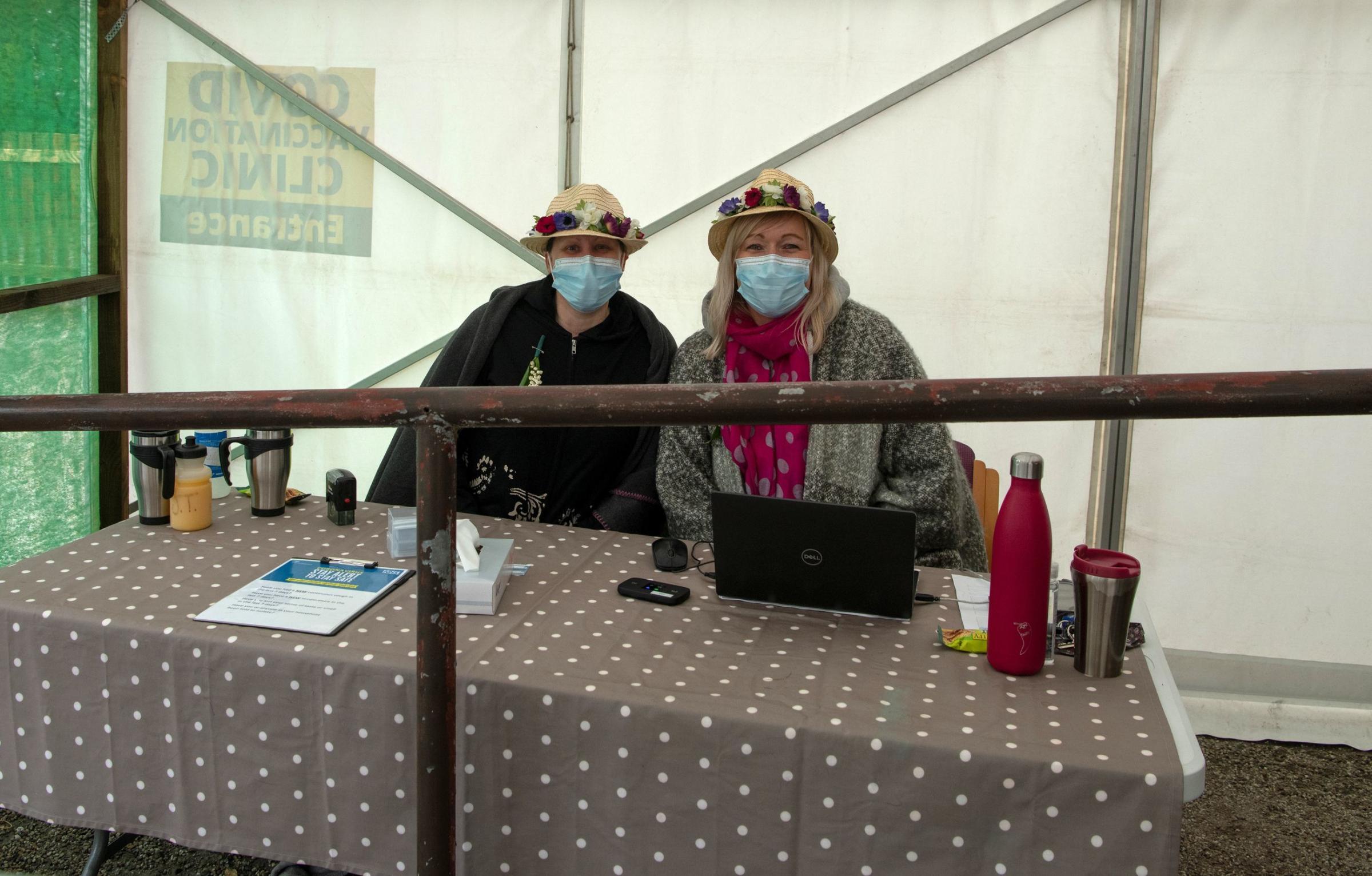 Volunteers at the Covid clinic at Helston Medical Centre mark the day with floral hats. Picture: Kathy White