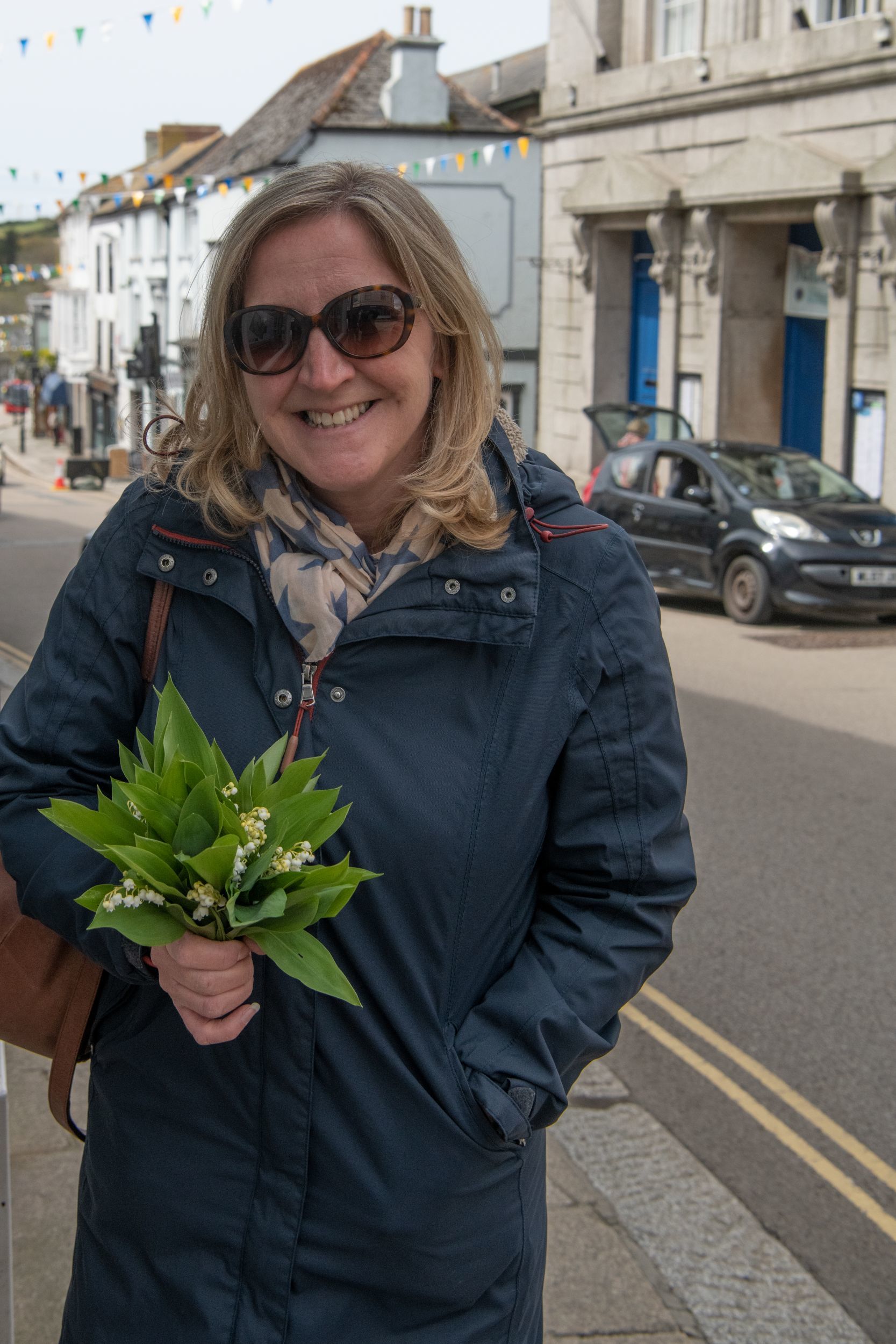 Rebecca Wills picks up her lily of the valley for Flora Day. Picture: Kathy White
