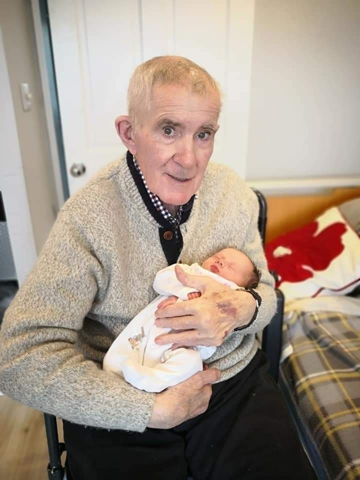 Jason’s grandad John Gribble, holding his great granddaughter Mia, before he sadly died in February 2021