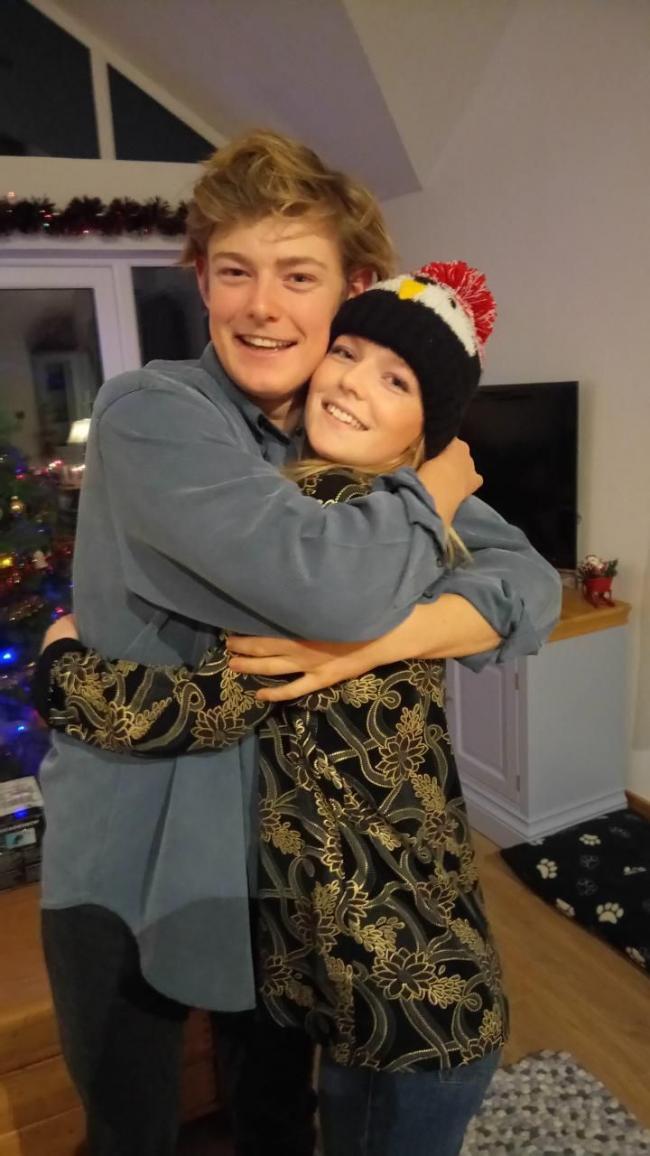 Chloe with her brother Charlie at a past Christmas