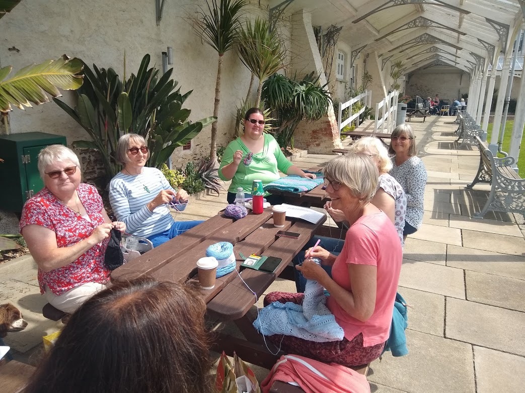 The In The Loop Knitters and Crochet group enjoy the sunshine